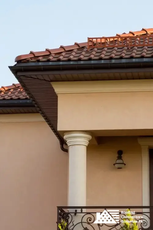 Elegant home with red tile roofing installed by skilled roofing professionals.