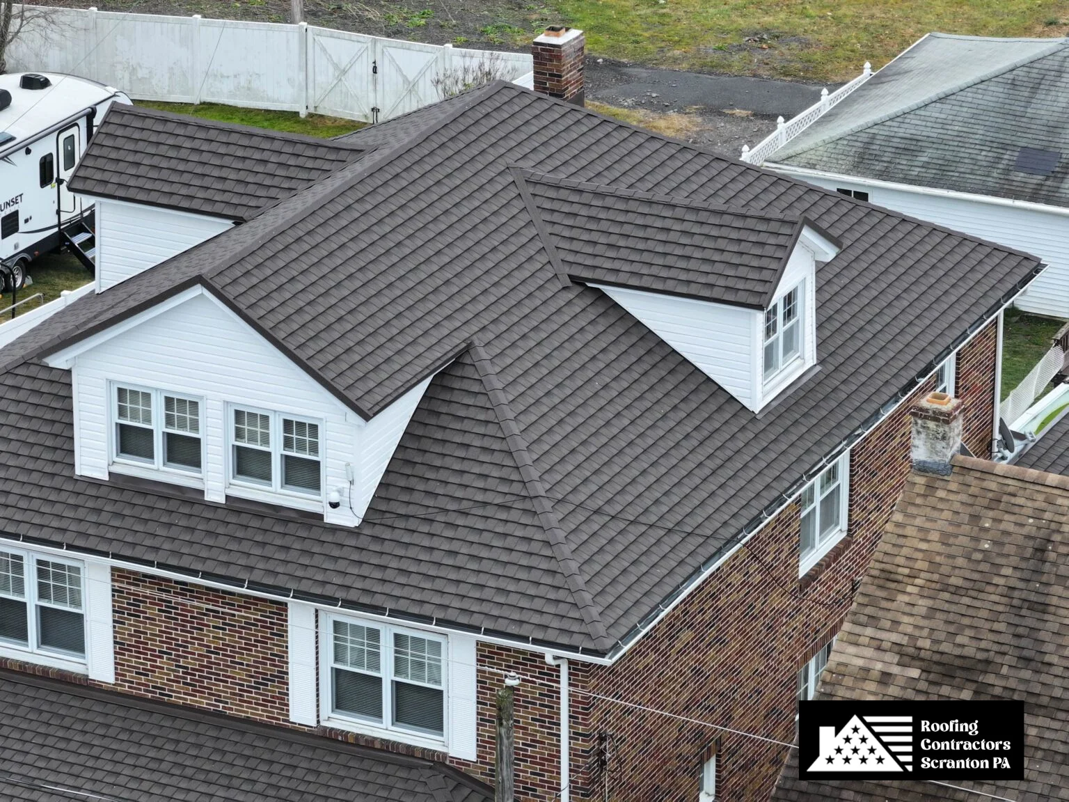 Brick home with a durable, weather-resistant asphalt shingle roof.