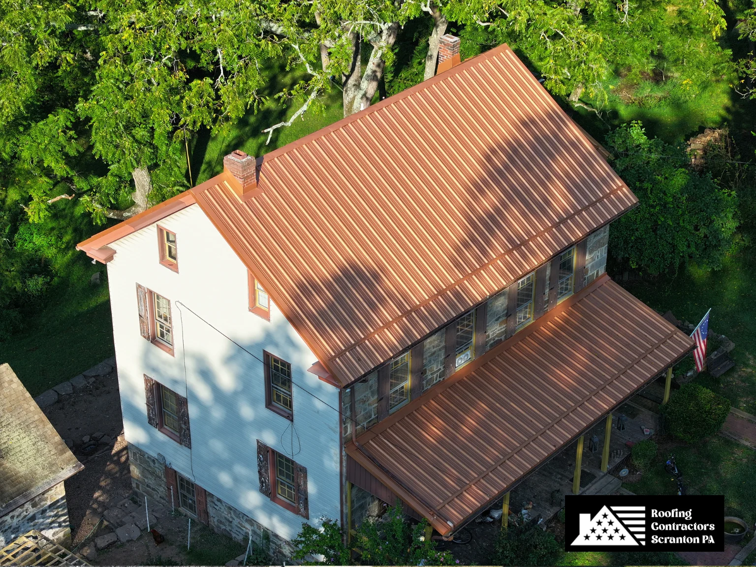 Traditional home with stylish copper-colored metal roofing.