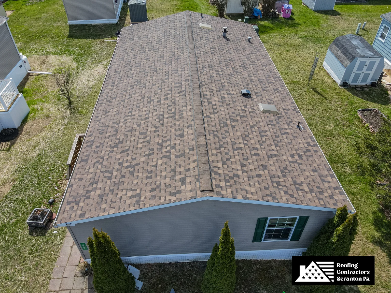 Large residential home with a newly installed blue shingle roof.